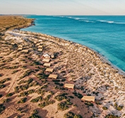 An aerial view of Sal Salis luxury camp, located on the shores of Ningaloo Reef in Western Australia.
